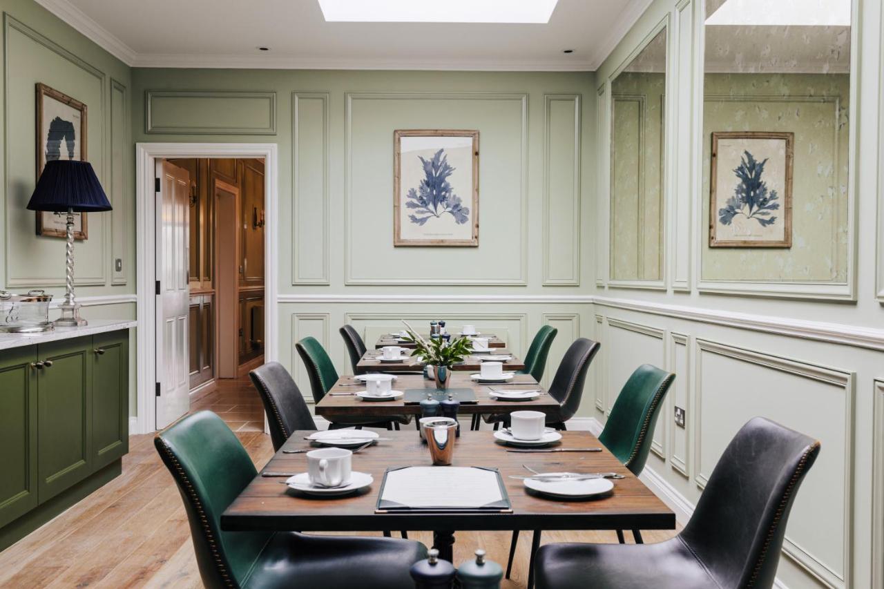 a dining room with a table and chairs at Tyndall Villa Boutique B&B in Bath